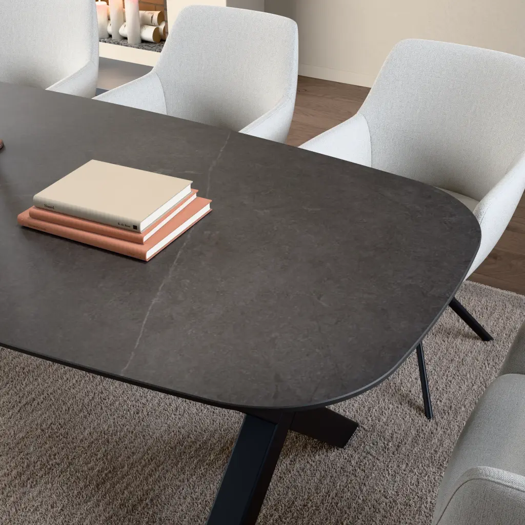 Ceramic table top Polar Black Sand. Surface and edge detail up close.